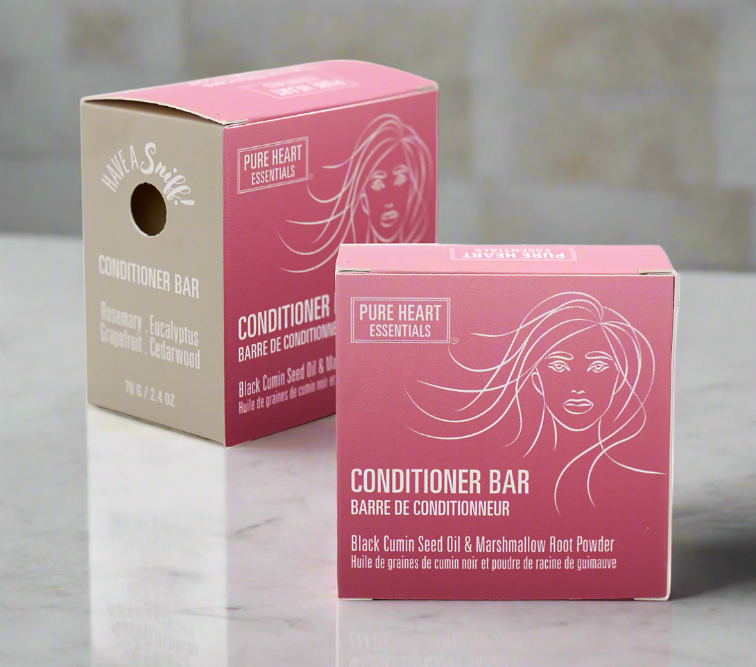 Two boxes of Pure Heart Essentials conditioner bars on a white background