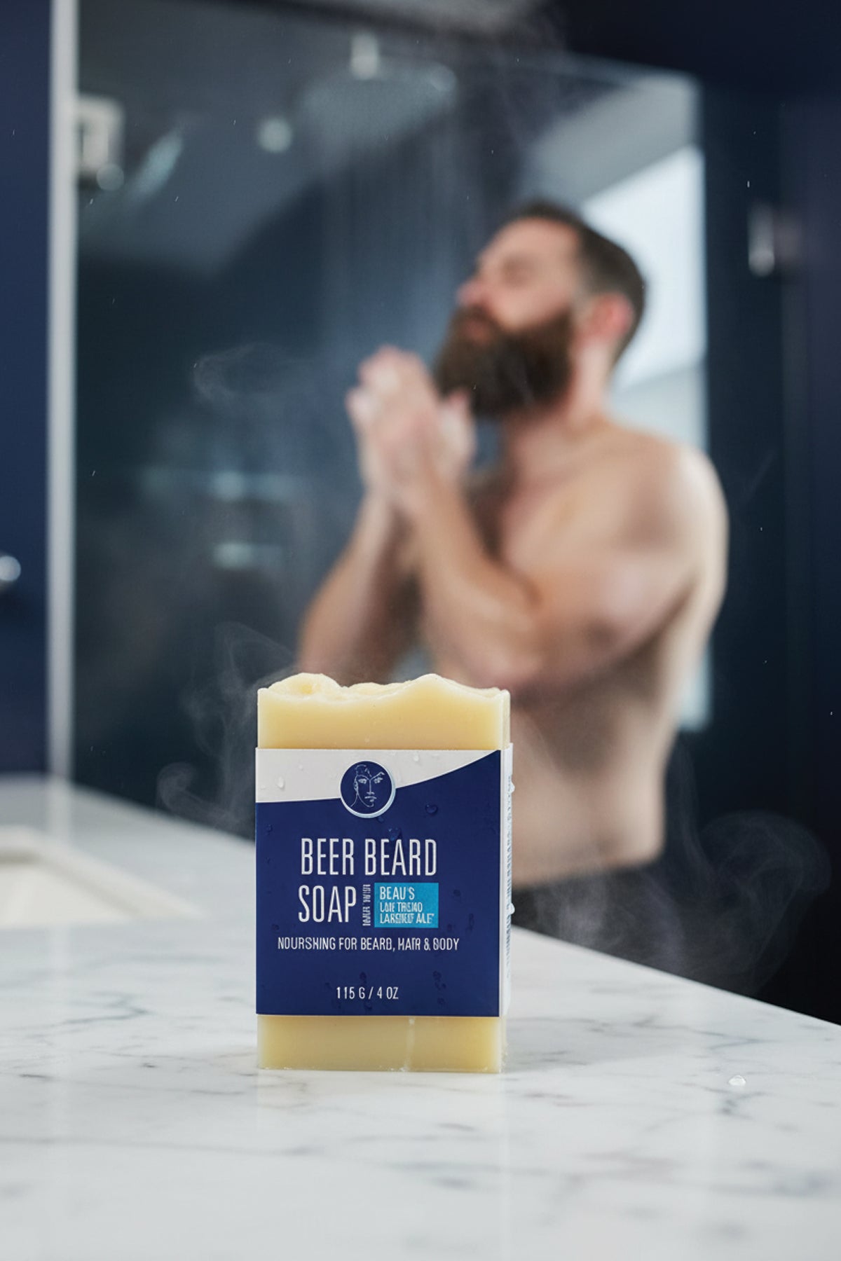Bar of beer beard soap on a marble surface with a blurred background of a person washing their face.