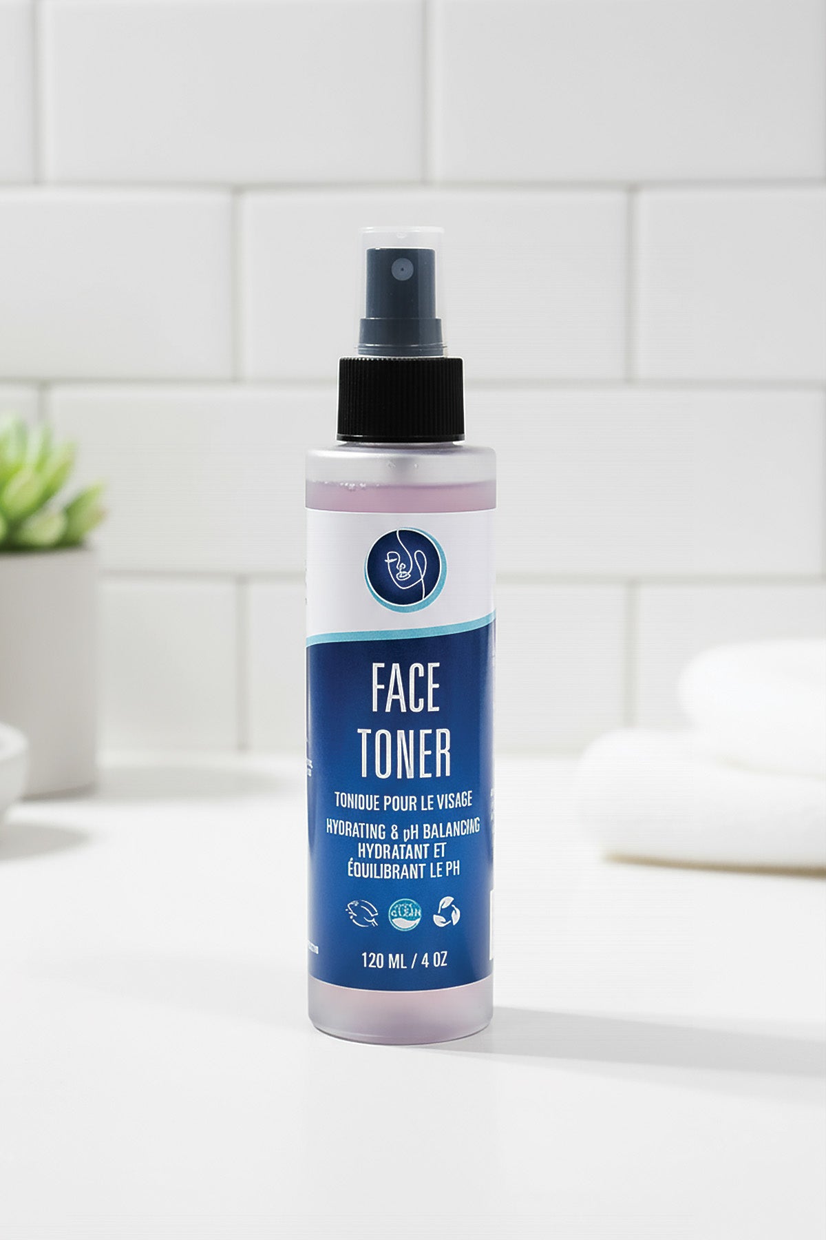 Bottle of face toner on a bathroom counter with a tiled wall background