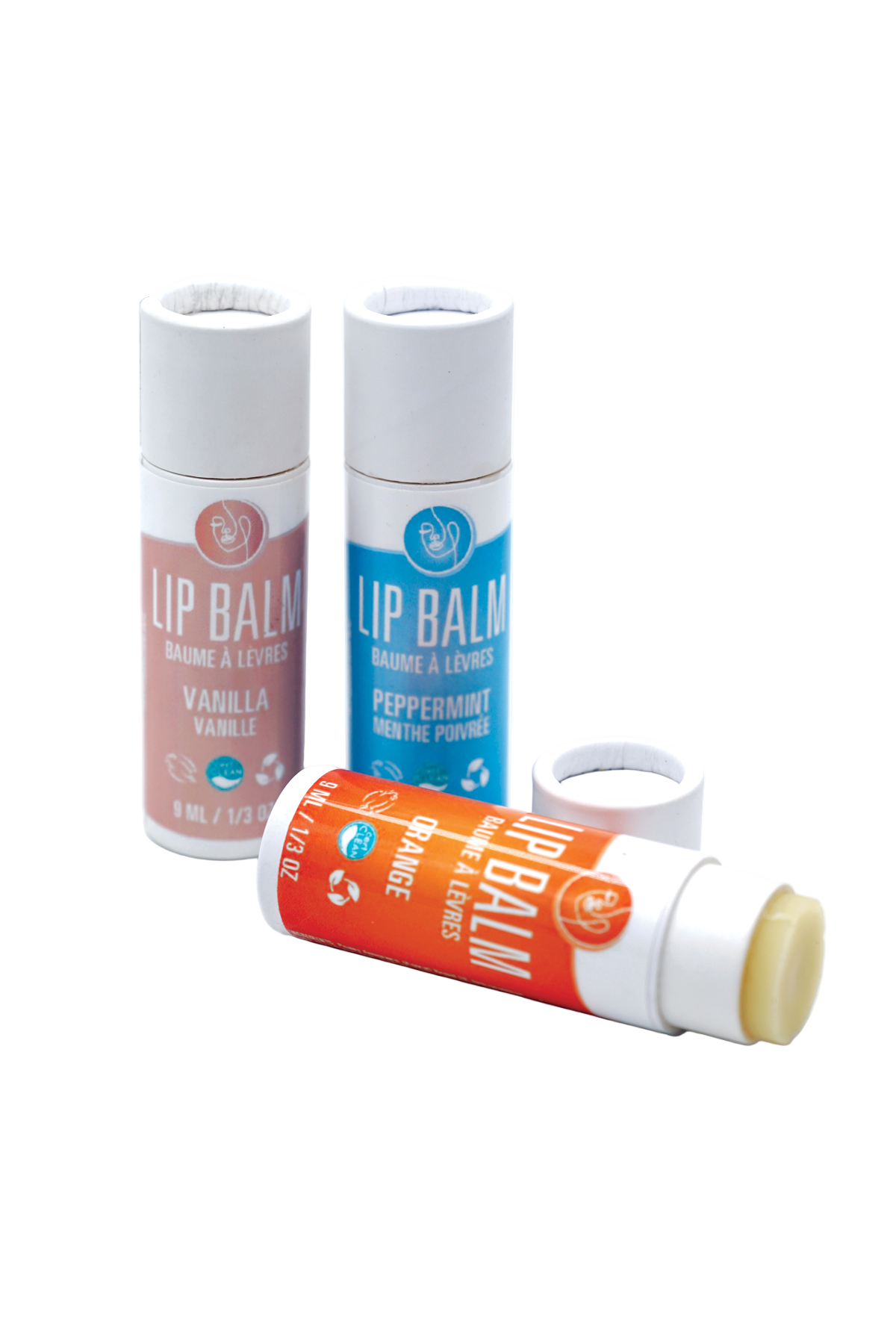 Three lip balm containers on a white background