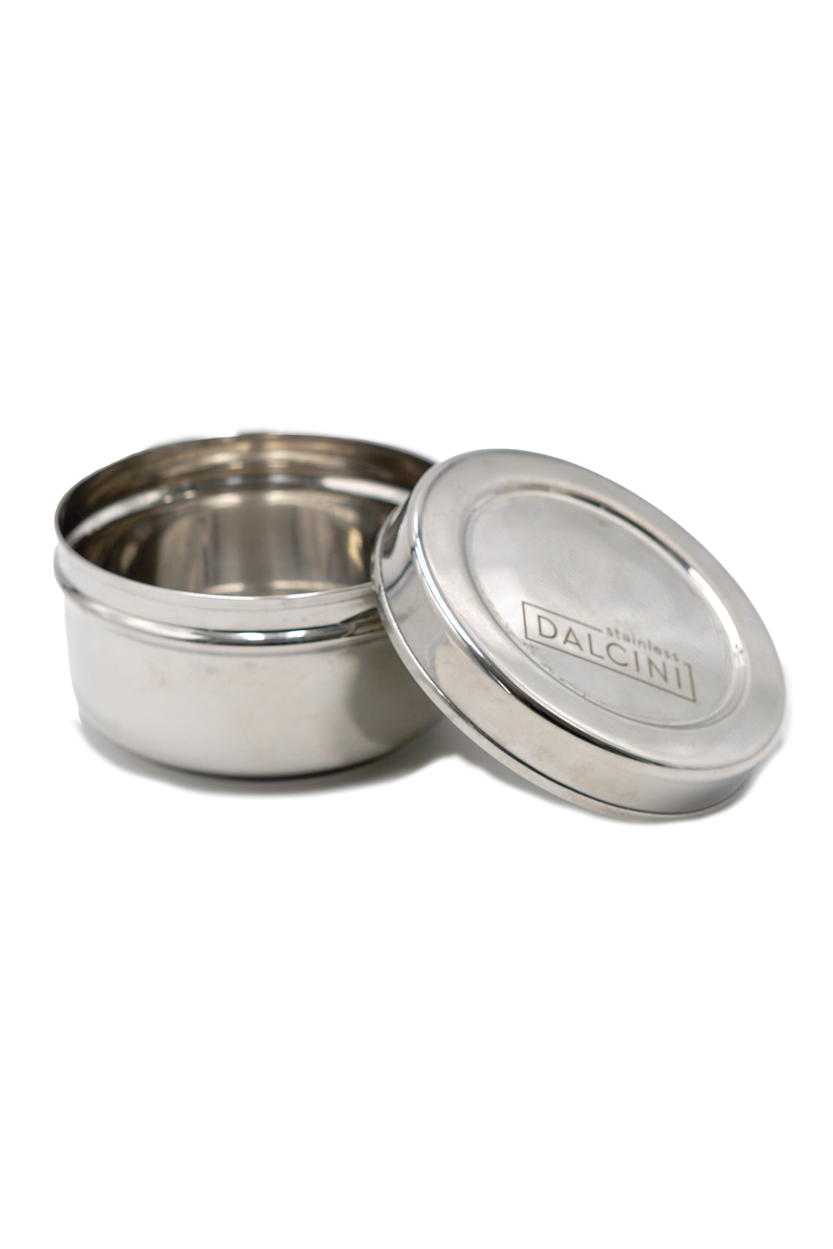 Stainless steel container with lid on a white background