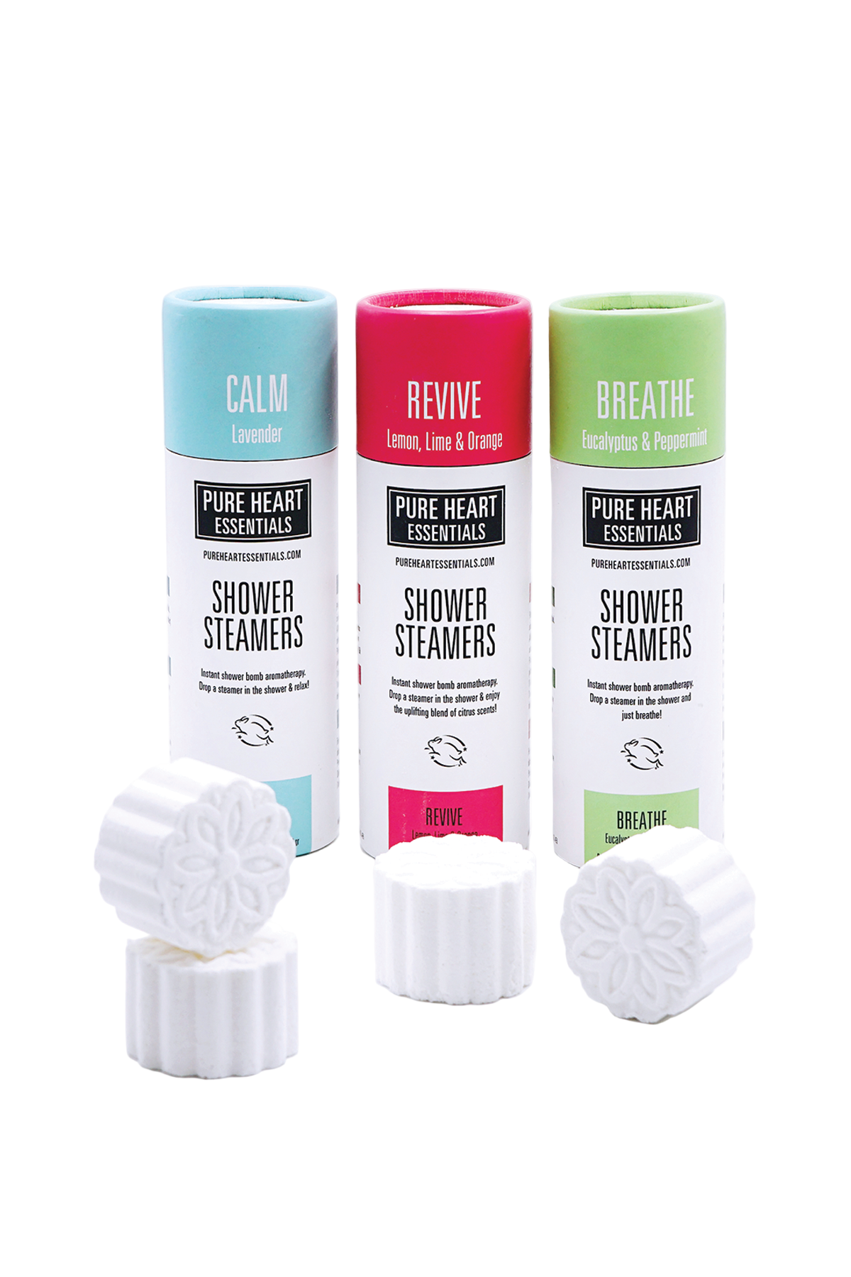 Three 'Pure Heart Essentials' shower steamers with different scents on a white background.