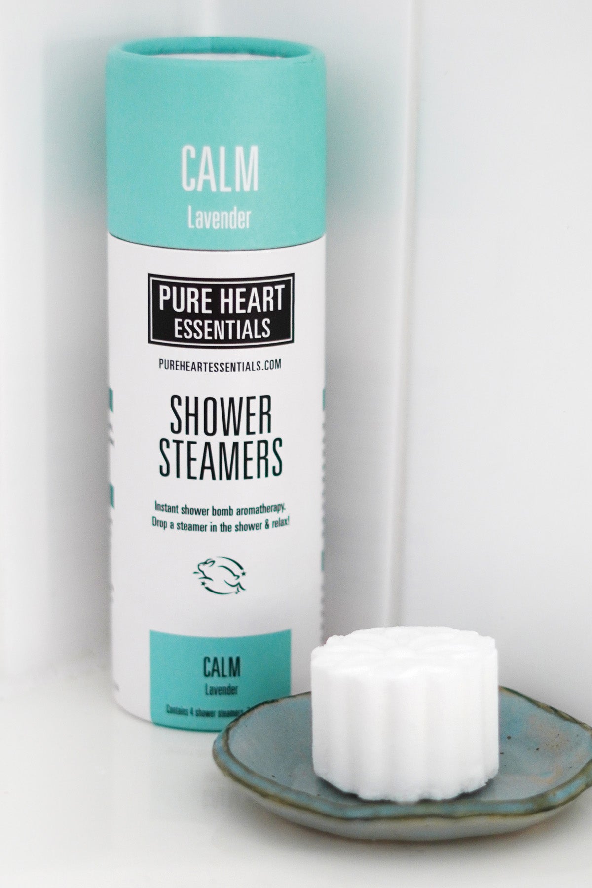 Shower steamers with a 'Pure Heart Essentials' label on a white background