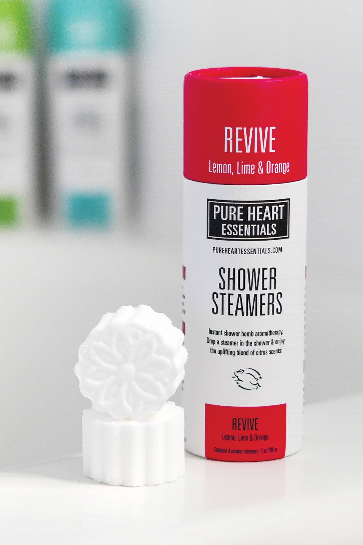 Shower steamer with 'Pure Heart Essentials' branding on a white background