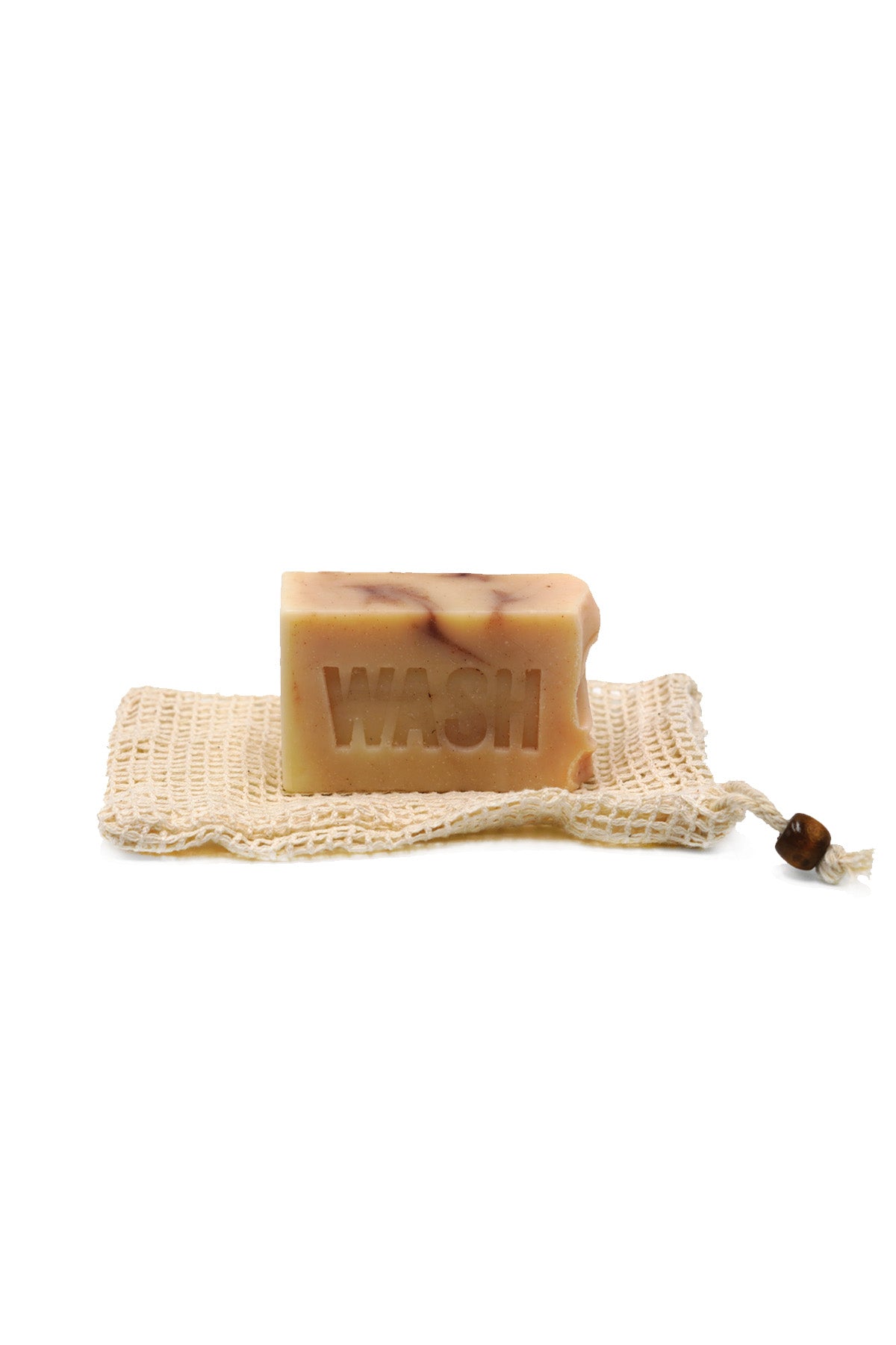 Bar of soap with 'WASH' text on a mesh soap bag against a white background