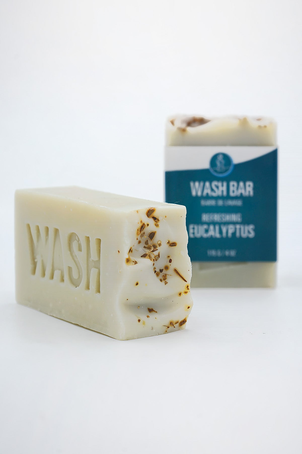 Bar of soap with 'WASH' branding and a box labeled 'Wash Bar Eucalyptus' on a white background
