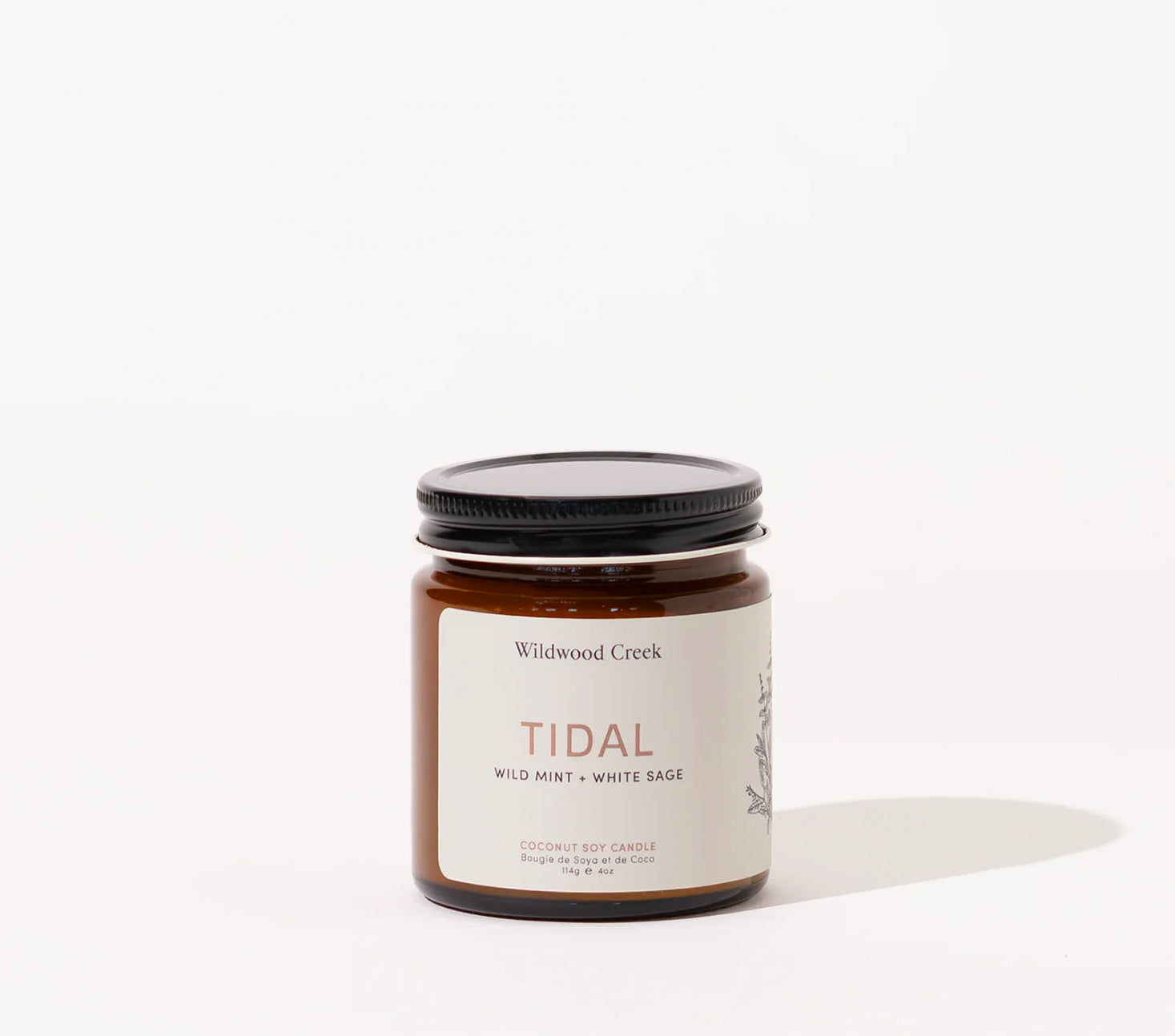 Candle jar labeled 'Tidal' by Wildwood Creek on a white background