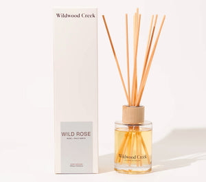 Wildwood Creek Wild Rose diffuser with packaging on a white background