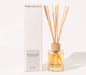 Wildwood Creek diffuser with reeds and packaging on a white background